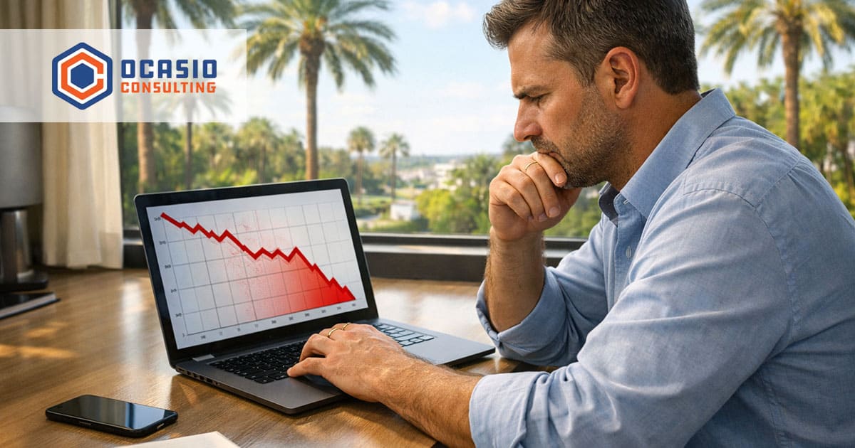 Small business owner checking Google March 2026 spam update traffic drop on laptop in Orlando office